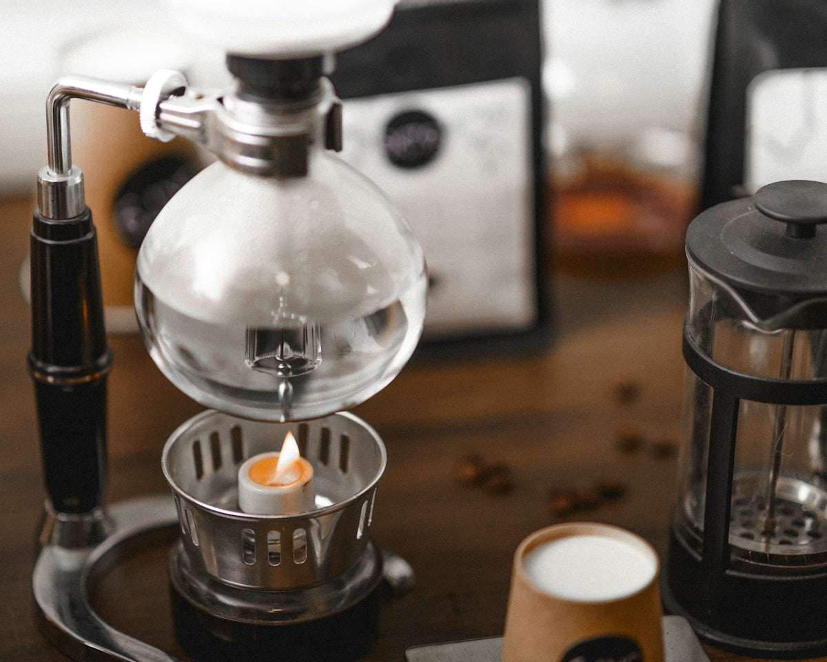 a coffee maker sitting on top of a wooden table