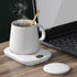 Electric coffee mug warmer with three temperature settings on a desk, USB-powered and compact design