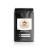 Assortment of six 2oz flavored coffee pouches including French Vanilla, Hazelnut, Cinnabun, Caramel, Mocha, and Cinnamon Hazelnut in a Flavored Coffees Sample Pack